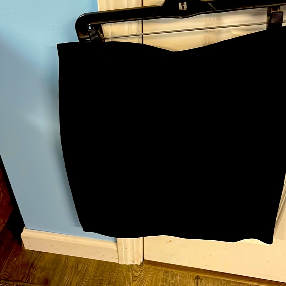 Black dress skirt, size 12, never worn with tags. Perfect condition, stylish